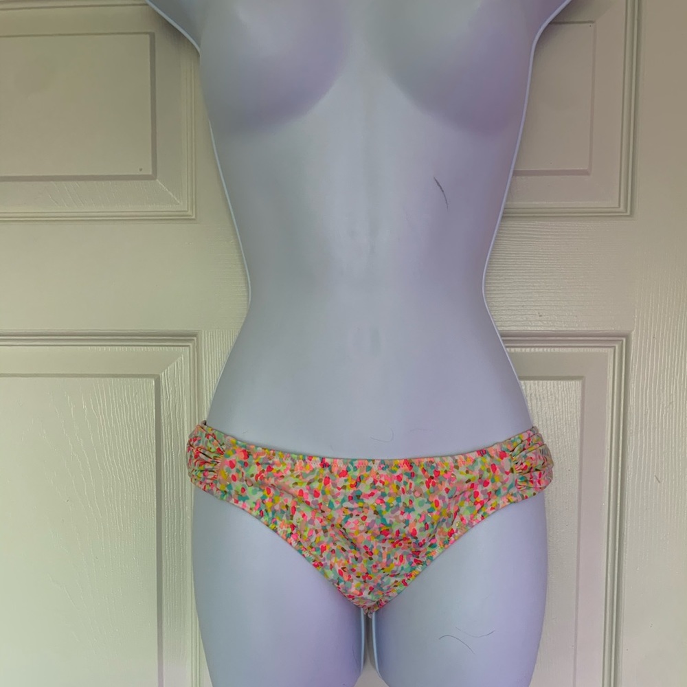 Victoria Secret low rise multi colored bathing suit bottoms. Size medium